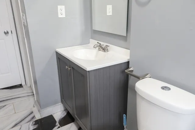 a bathroom with a sink and mirror