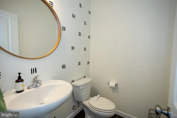 a bedroom with a bed a dresser and a book shelf
