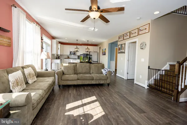 a living room with furniture fireplace and flat screen tv