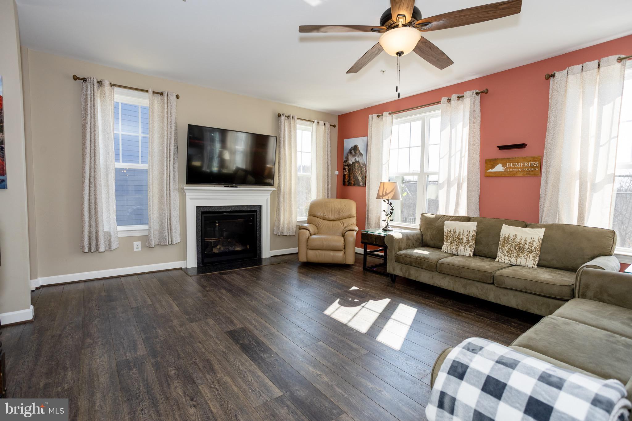 2425 Morgans Point Drive Dumfries, VA 22026 - Photo 34 of 99 a living room with furniture fireplace and flat screen tv