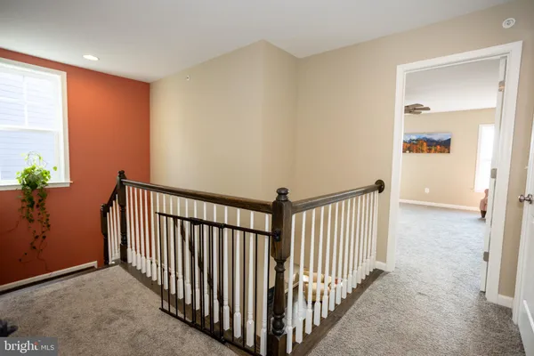 a view of walk in closet with clothes