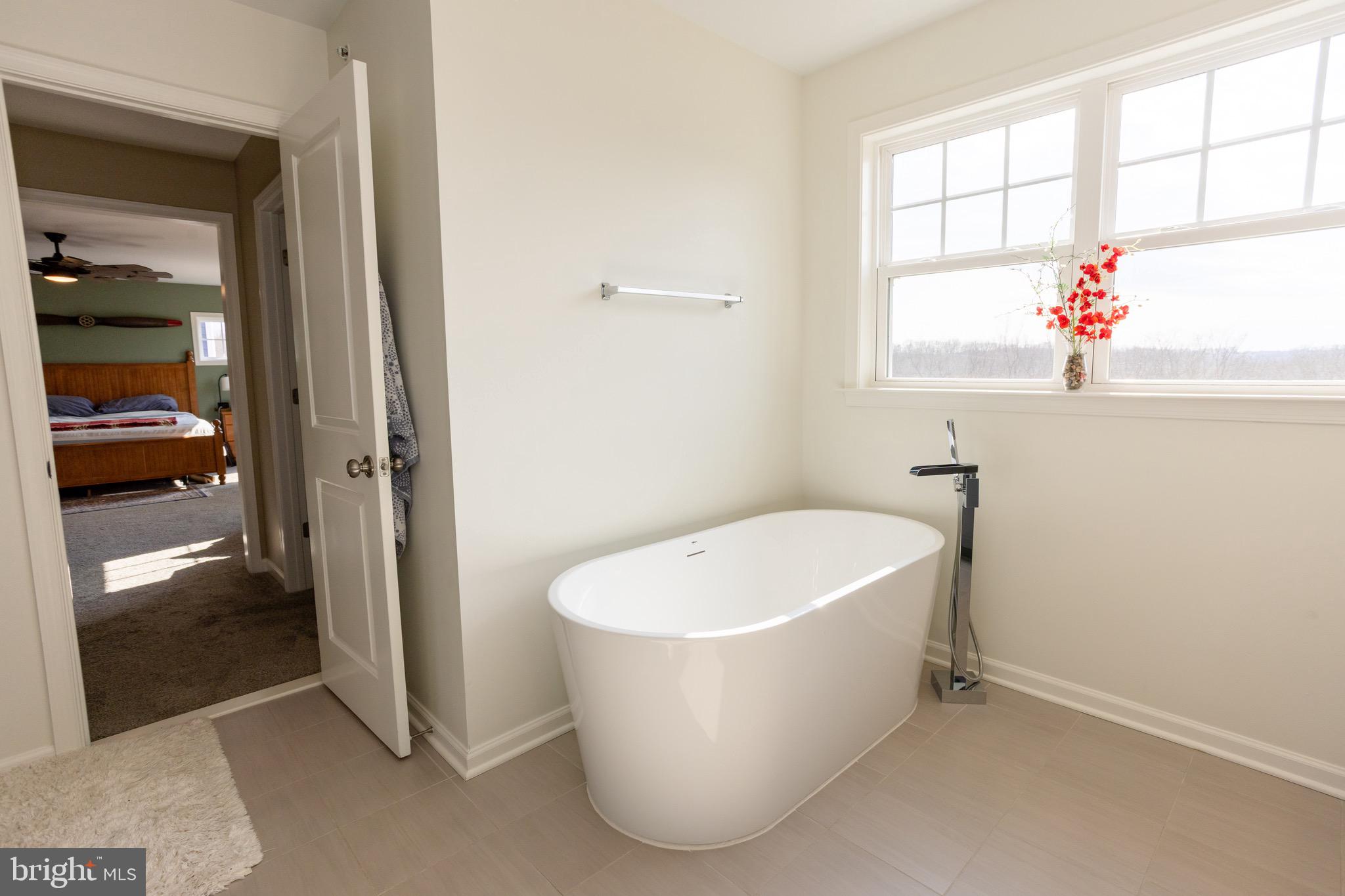 2425 Morgans Point Drive Dumfries, VA 22026 - Photo 48 of 99 a white bath tub sitting in a bathroom