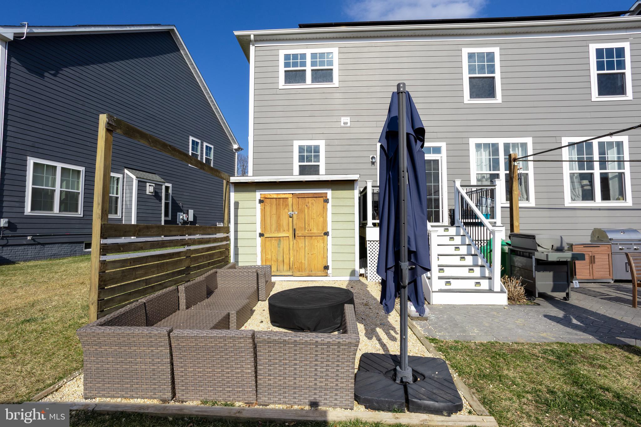 2425 Morgans Point Drive Dumfries, VA 22026 - Photo 68 of 99 a front view of a house with a garden and patio