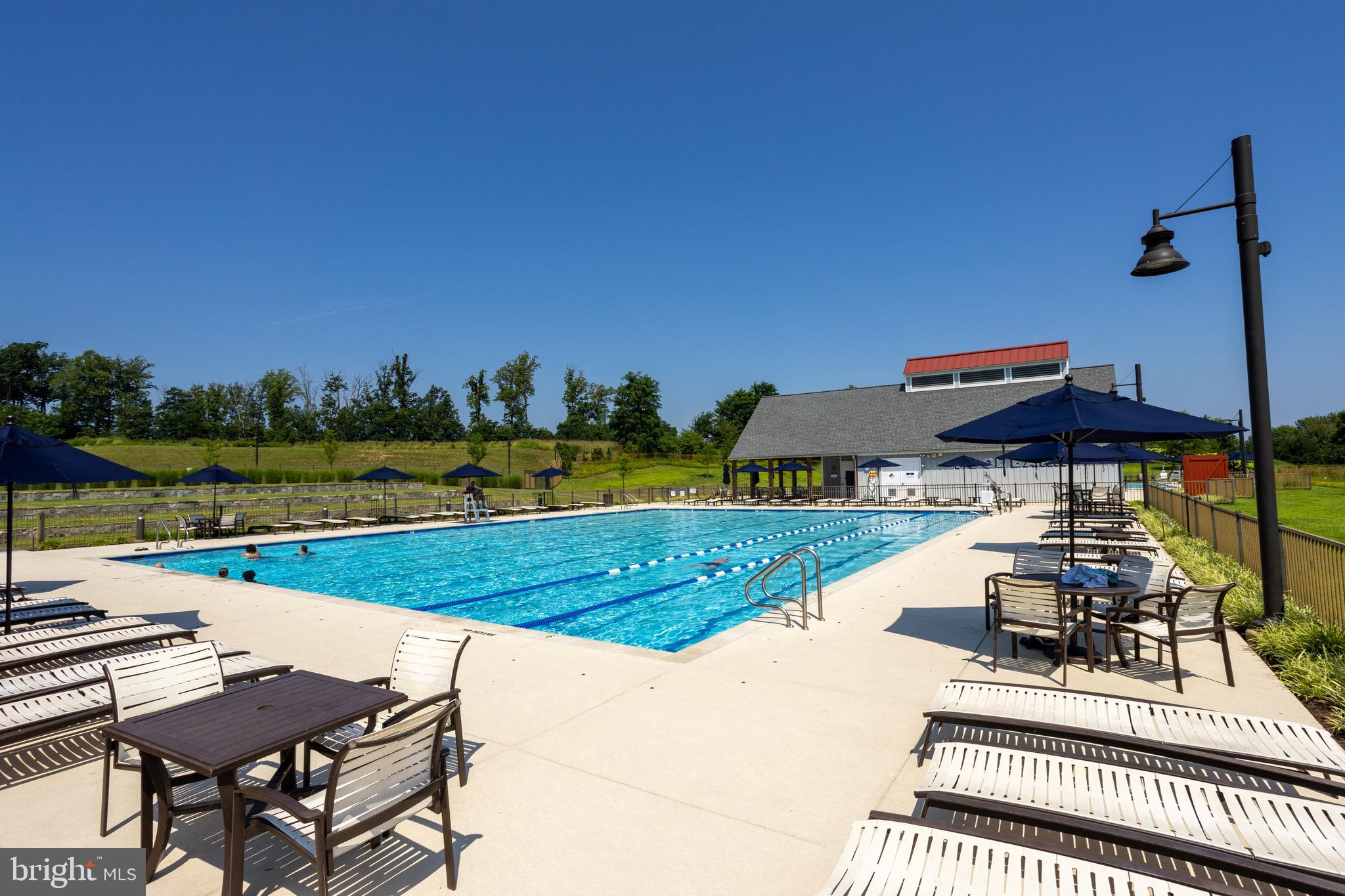 2425 Morgans Point Drive Dumfries, VA 22026 - Photo 82 of 99 a view of a swimming pool and lounge chairs