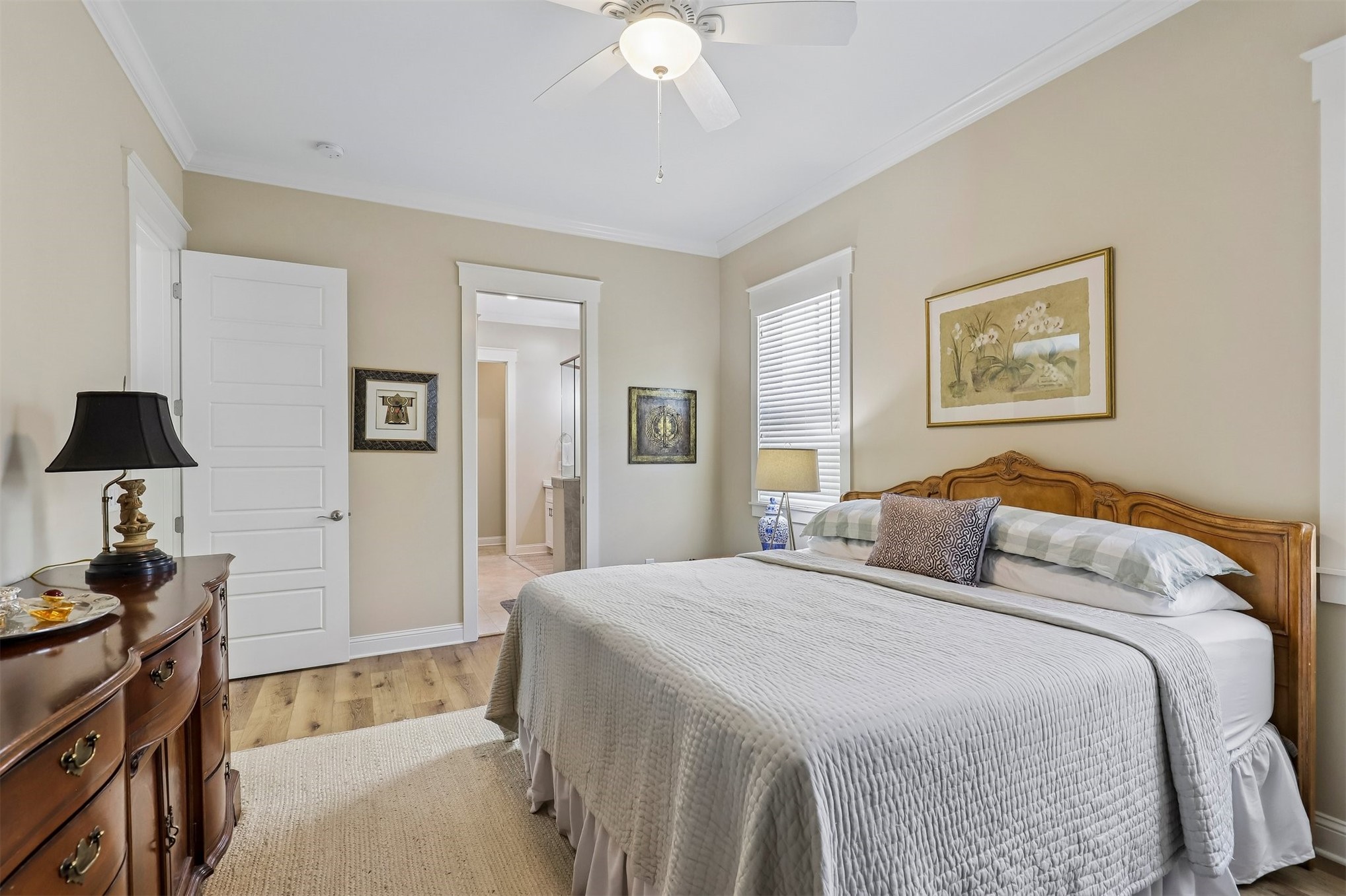 1012 White Street Fernandina Beach, FL 32034 - Photo 19 of 35 a bedroom with a bed and a chandelier