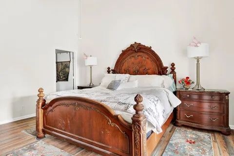 a bedroom with a bed and a dresser