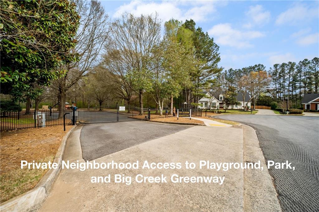 7105 Sheffield Place Cumming, GA 30040 - Photo 49 of 73 a view of outdoor space with trees all around