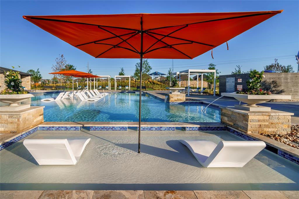 7113 Mallow Lane Venus, TX 76084 - Photo 6 of 14 a view of a patio with table and chairs under an umbrella