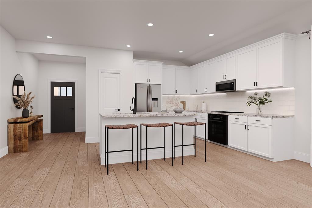 7113 Mallow Lane Venus, TX 76084 - Photo 10 of 14 a kitchen with a sink cabinets and wooden floor