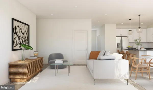 a living room with furniture and a lamp