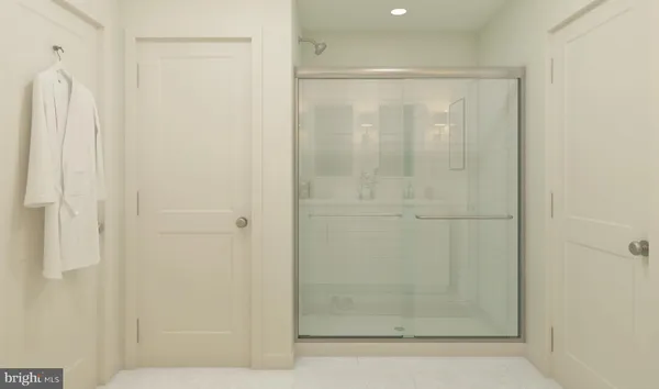 a bathroom with a glass shower door
