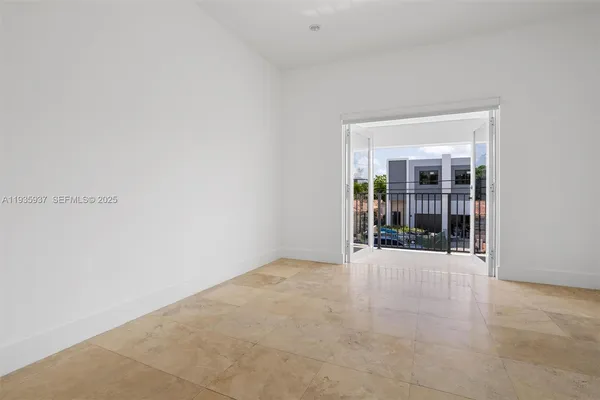 a view of a hallway with windows