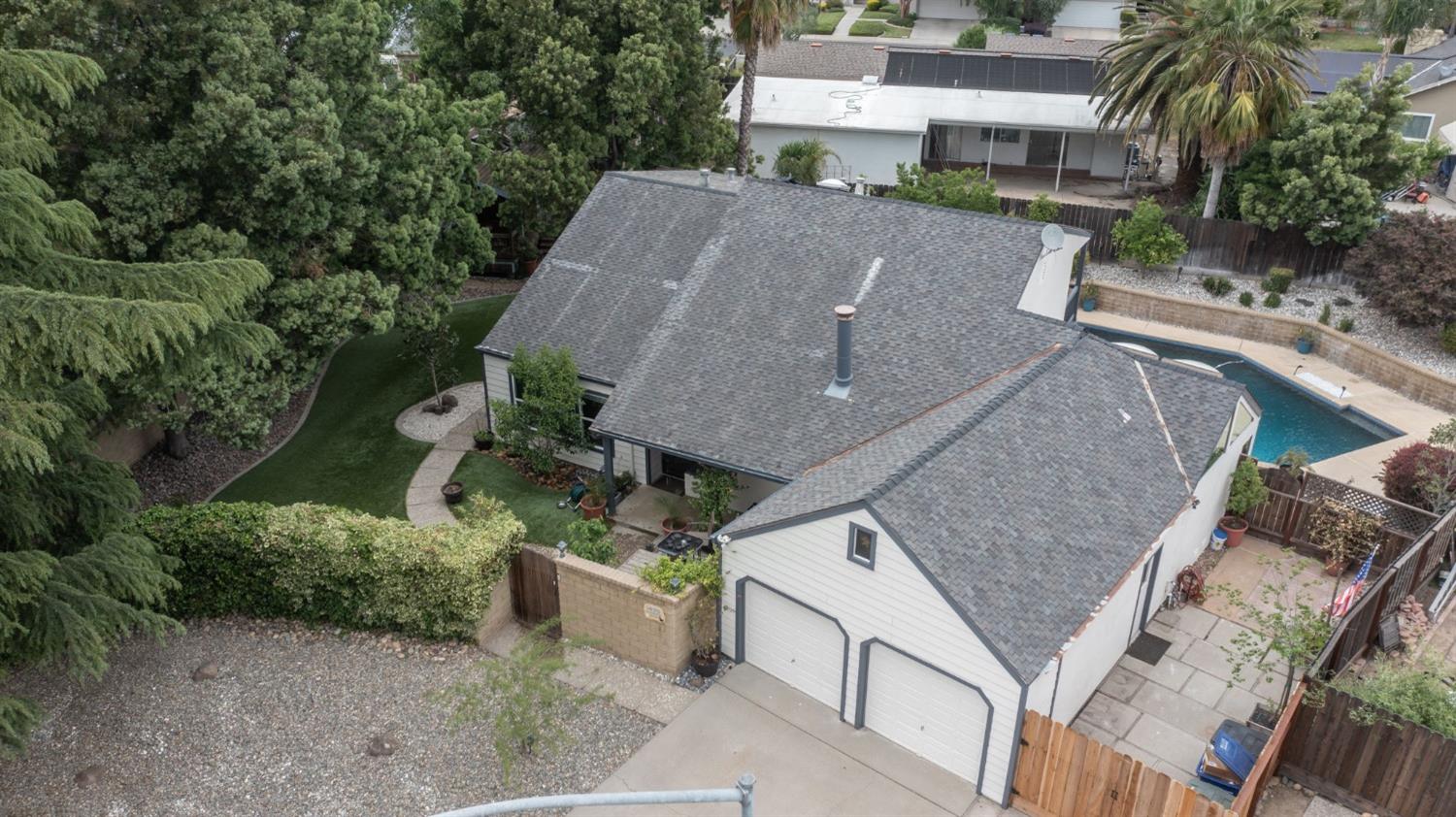 an aerial view of a house with outdoor space