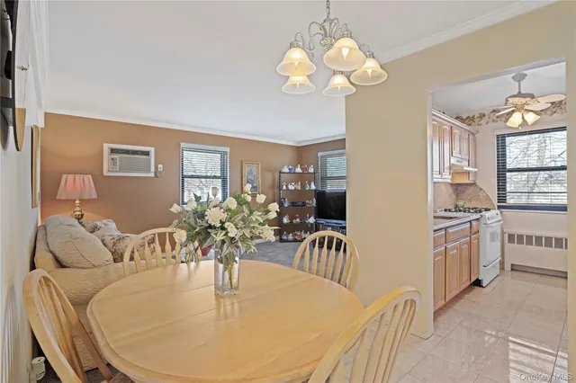 a dining room with furniture a livingroom and chandelier