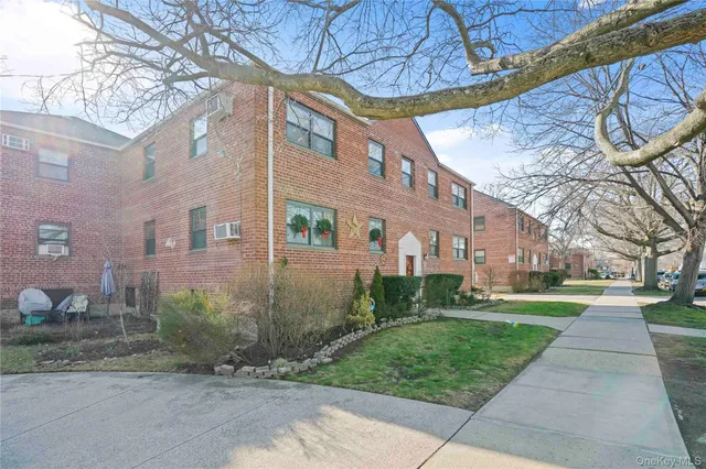 a view of a building with a yard