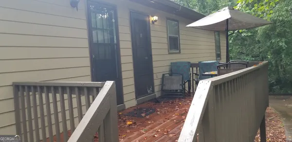 a balcony view with a seating space