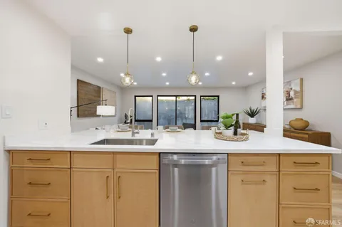 a bedroom with a large bed and a large window