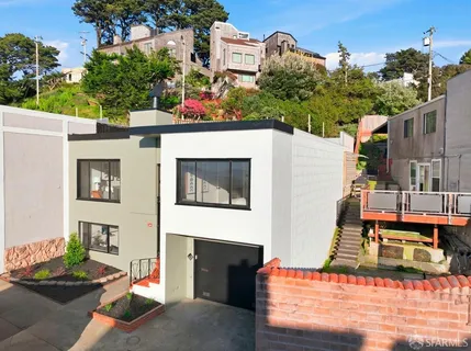 a living room with furniture a window and a table