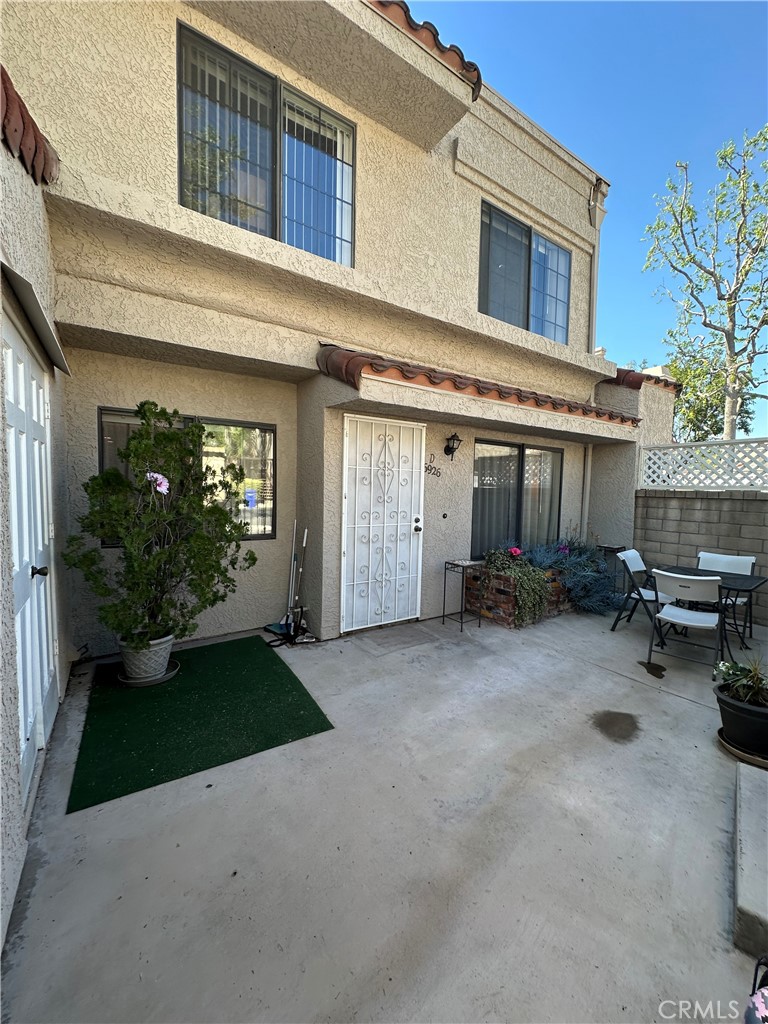 6926 Laguna Place, Unit D Rancho Cucamonga, CA 91701 - Photo 1 of 1 a view of a house with backyard and sitting area