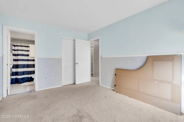 a view of an empty room with a cabinet