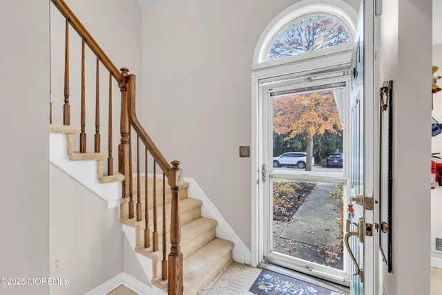 a view of front door with wooden floor