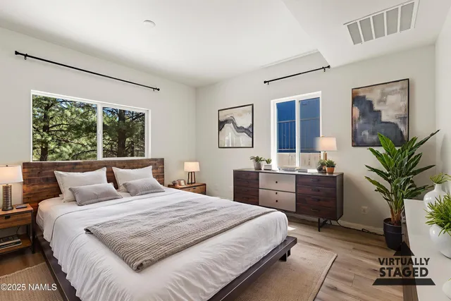 a bathroom with a double vanity sink mirror and shower