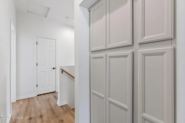 a bedroom with a bed and a television