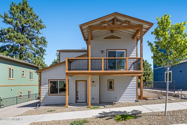 a view of a kitchen with a sink a microwave and a stove