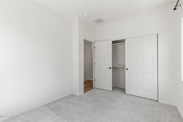 a view of a pathway with a yard