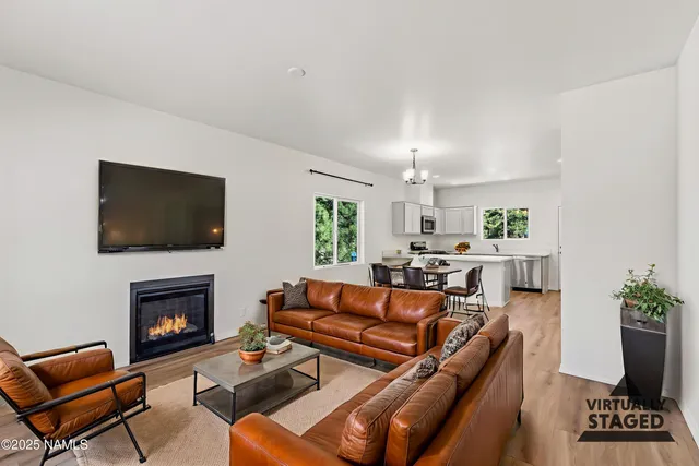 a kitchen with a sink window and cabinets