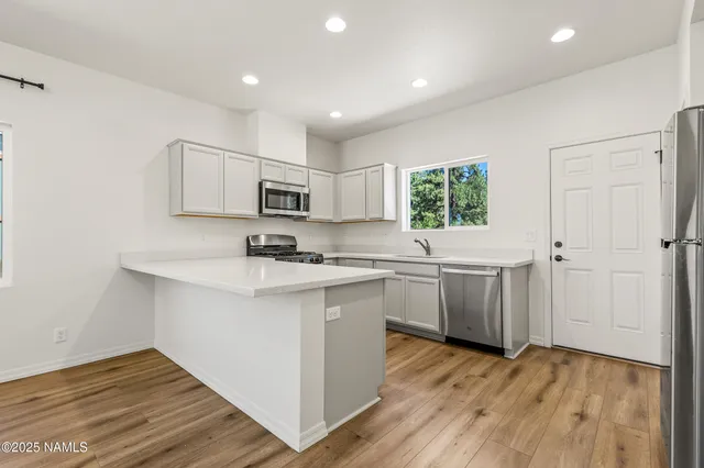 a bathroom with a sink a mirror and a toilet