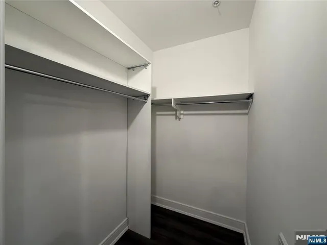 a view of a hallway with washer and dryer