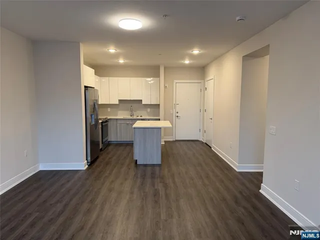 a view of kitchen with wooden floor