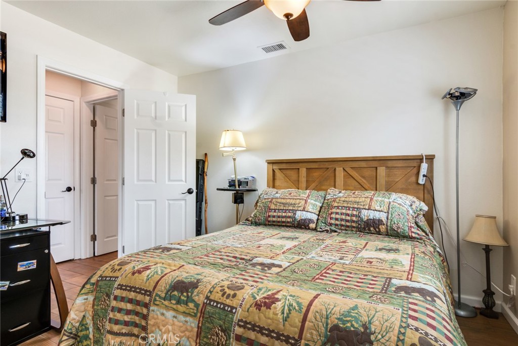 3198 Bexfield Court Riverside, CA 92503 - Photo 13 of 24 Bedroom #2 with Ceiling Fan and Views of Backyard