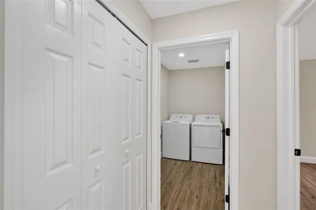 a bathroom with double vanity sinks and two mirror