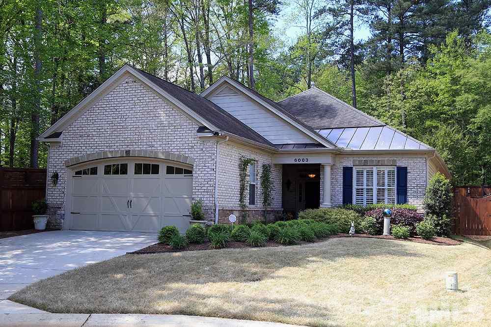 6003 Magenta Court Raleigh, NC 27617 - Photo 1 of 30 a view of a house with a yard plants and large tree