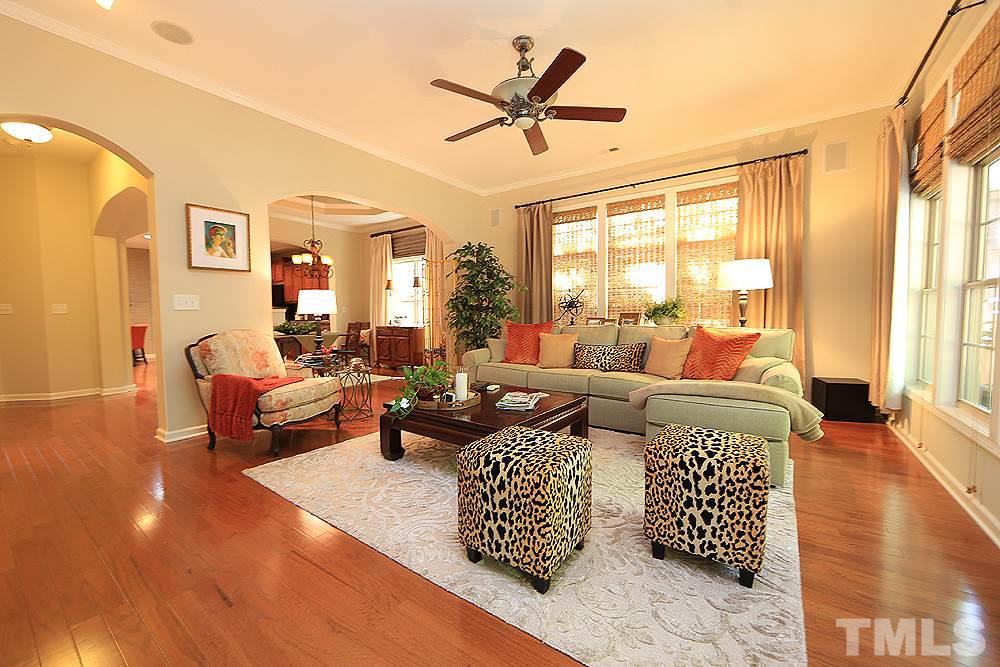 6003 Magenta Court Raleigh, NC 27617 - Photo 14 of 30 a living room with furniture and a large window with garden view