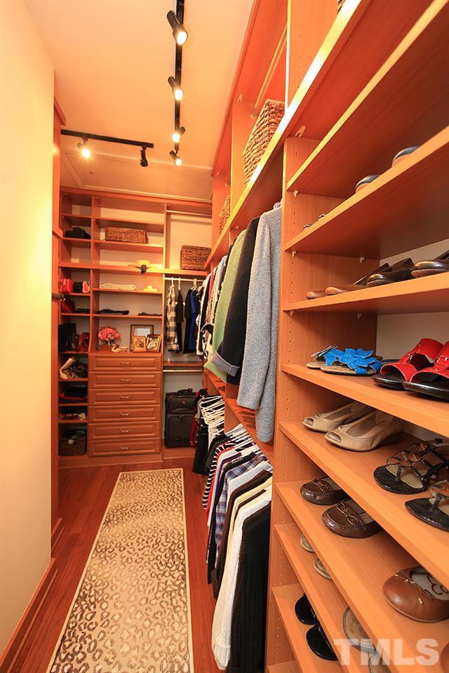 6003 Magenta Court Raleigh, NC 27617 - Photo 20 of 30 a view of walk in closet with clothes and shoes