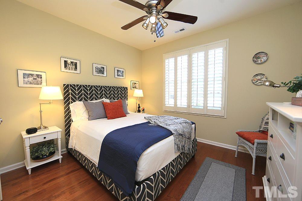 6003 Magenta Court Raleigh, NC 27617 - Photo 22 of 30 a bedroom with a bed and a window