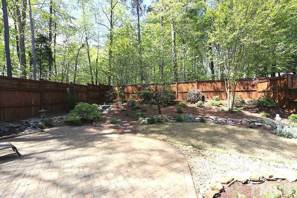 6003 Magenta Court Raleigh, NC 27617 - Photo 26 of 30 a view of a yard with plants and large trees