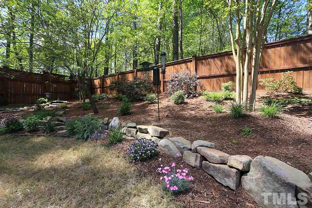 6003 Magenta Court Raleigh, NC 27617 - Photo 28 of 30 a backyard of a house with lots of green space
