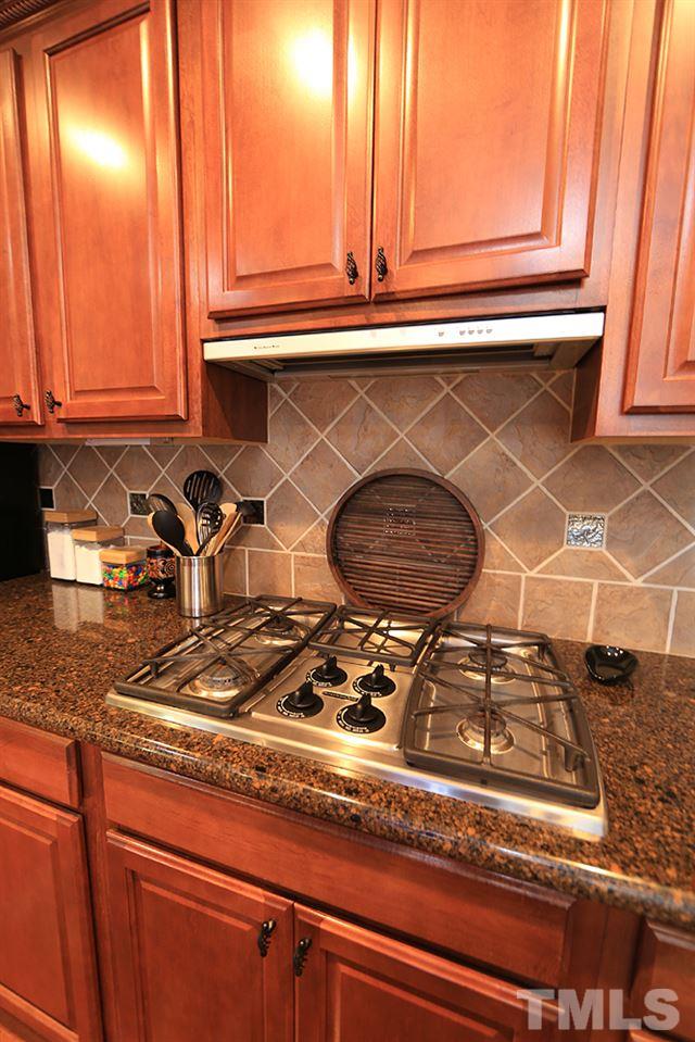 6003 Magenta Court Raleigh, NC 27617 - Photo 8 of 30 a kitchen with a stove and a sink