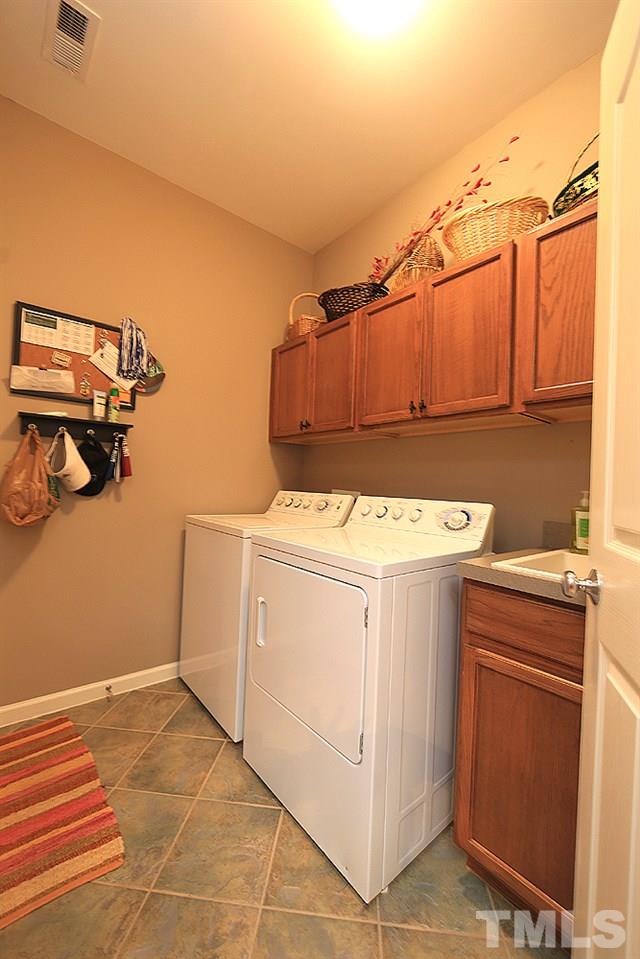 6003 Magenta Court Raleigh, NC 27617 - Photo 10 of 30 a utility room with dryer and washer