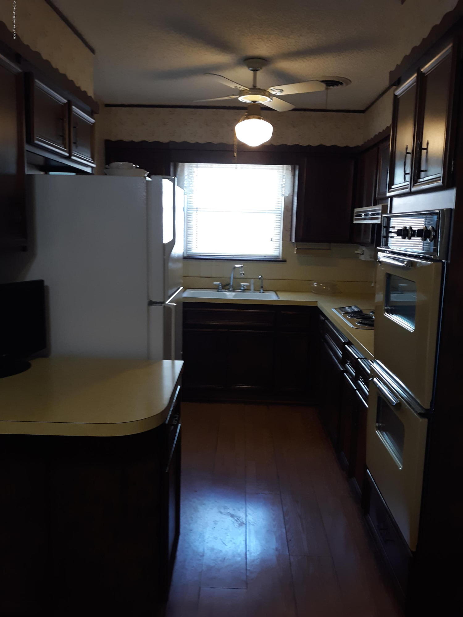 5147 McCarty Boulevard Amarillo, TX 79110 - Photo 6 of 14 a kitchen with stainless steel appliances granite countertop a sink a stove and a refrigerator