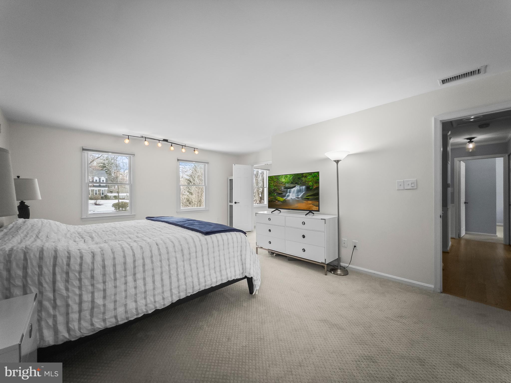 21600 Glendalough Road Gaithersburg, MD 20882 - Photo 31 of 64 a bedroom with a bed and walk in closet