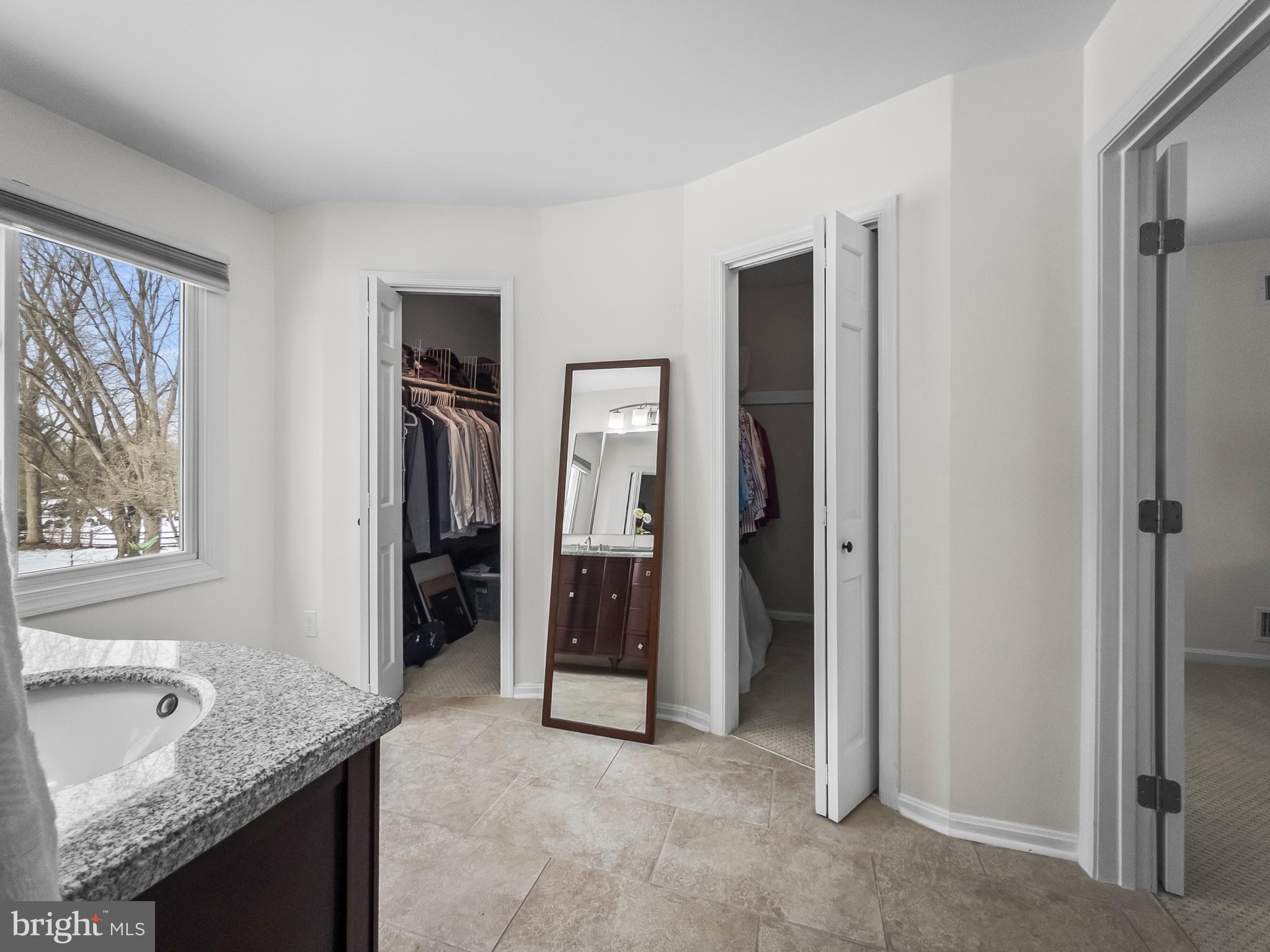 21600 Glendalough Road Gaithersburg, MD 20882 - Photo 34 of 64 a bathroom with a granite countertop sink and a mirror