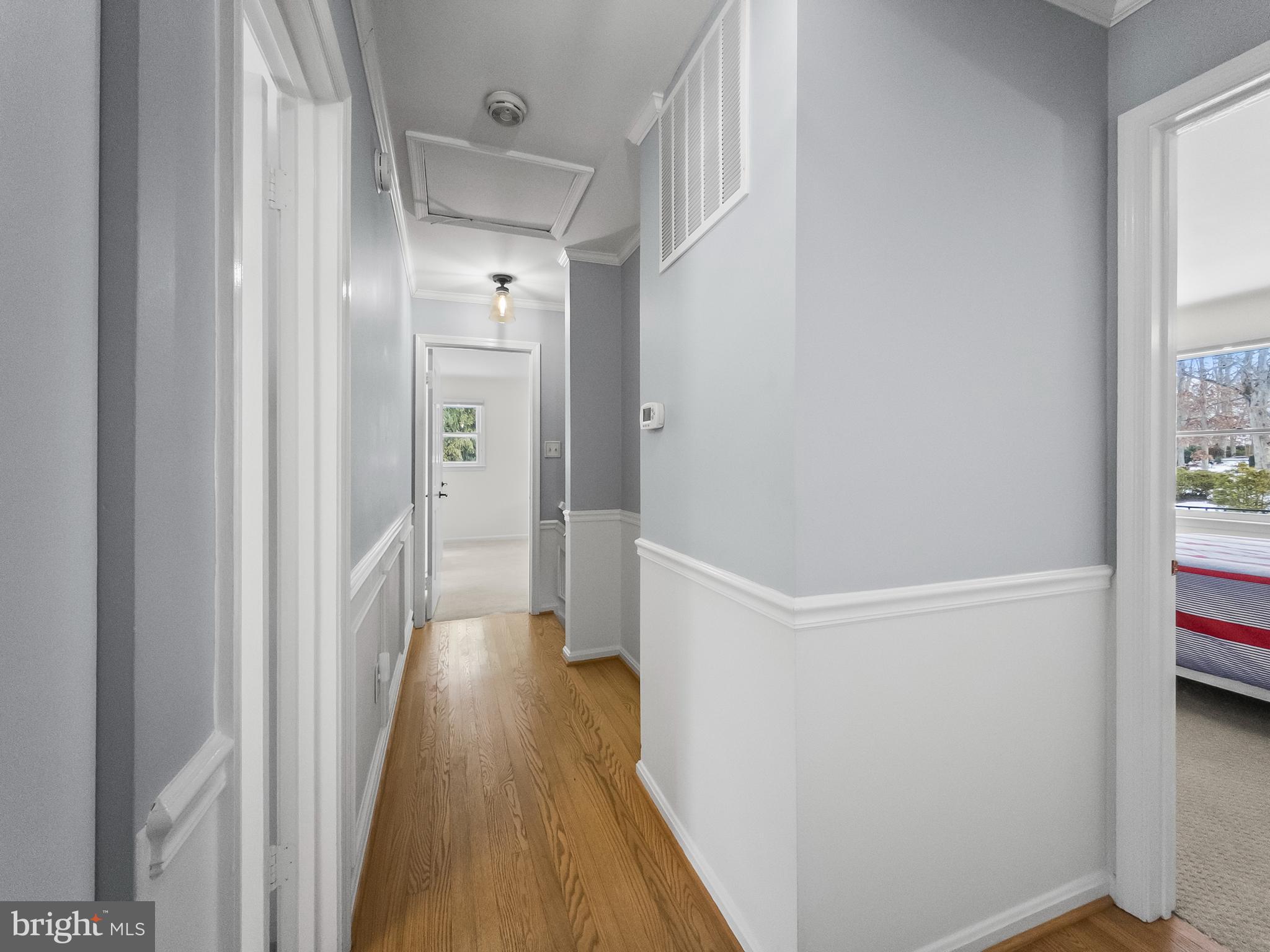 21600 Glendalough Road Gaithersburg, MD 20882 - Photo 37 of 64 a view of a hallway with wooden floor and closet
