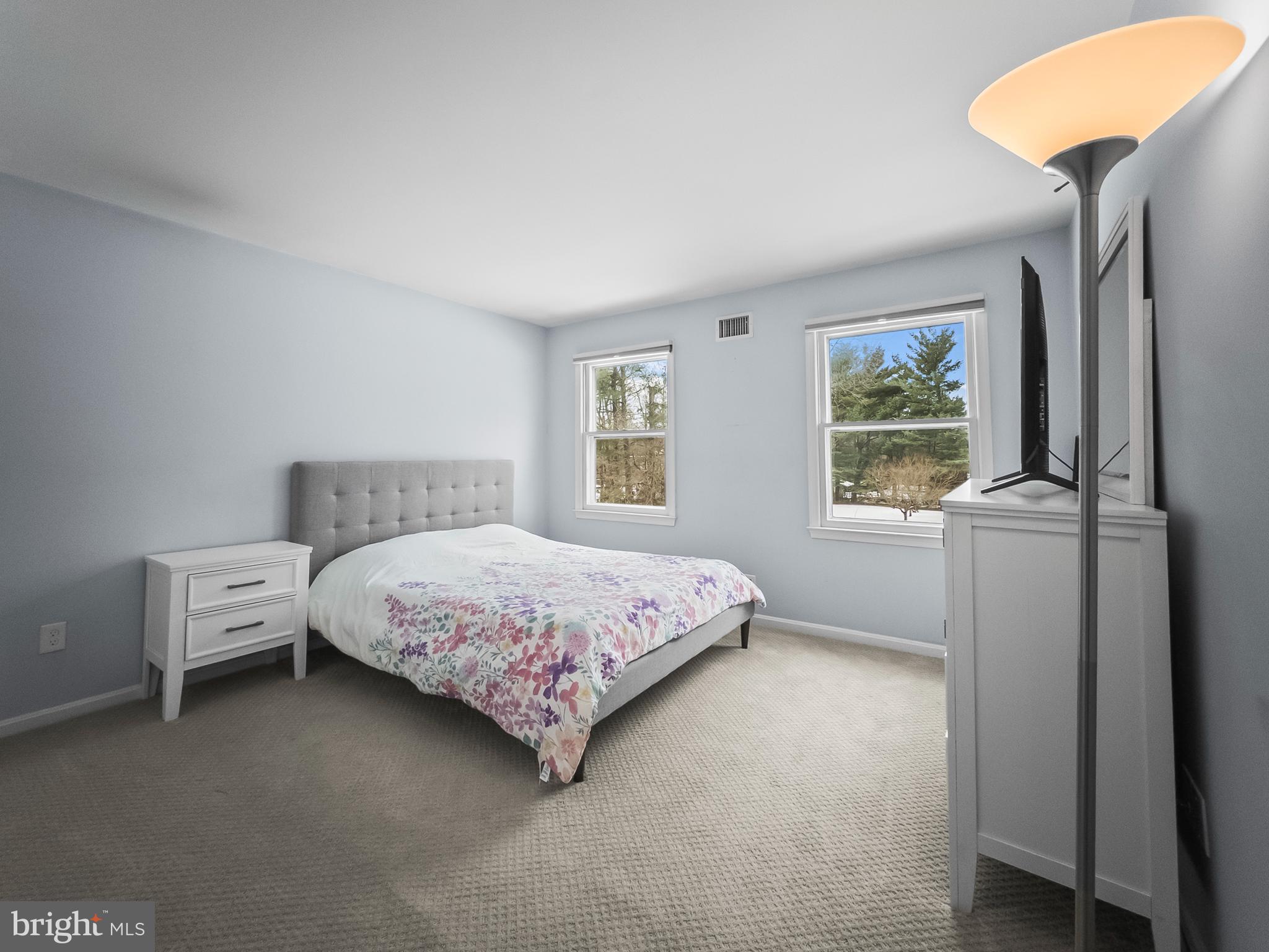 21600 Glendalough Road Gaithersburg, MD 20882 - Photo 38 of 64 a bedroom with a bed and a window