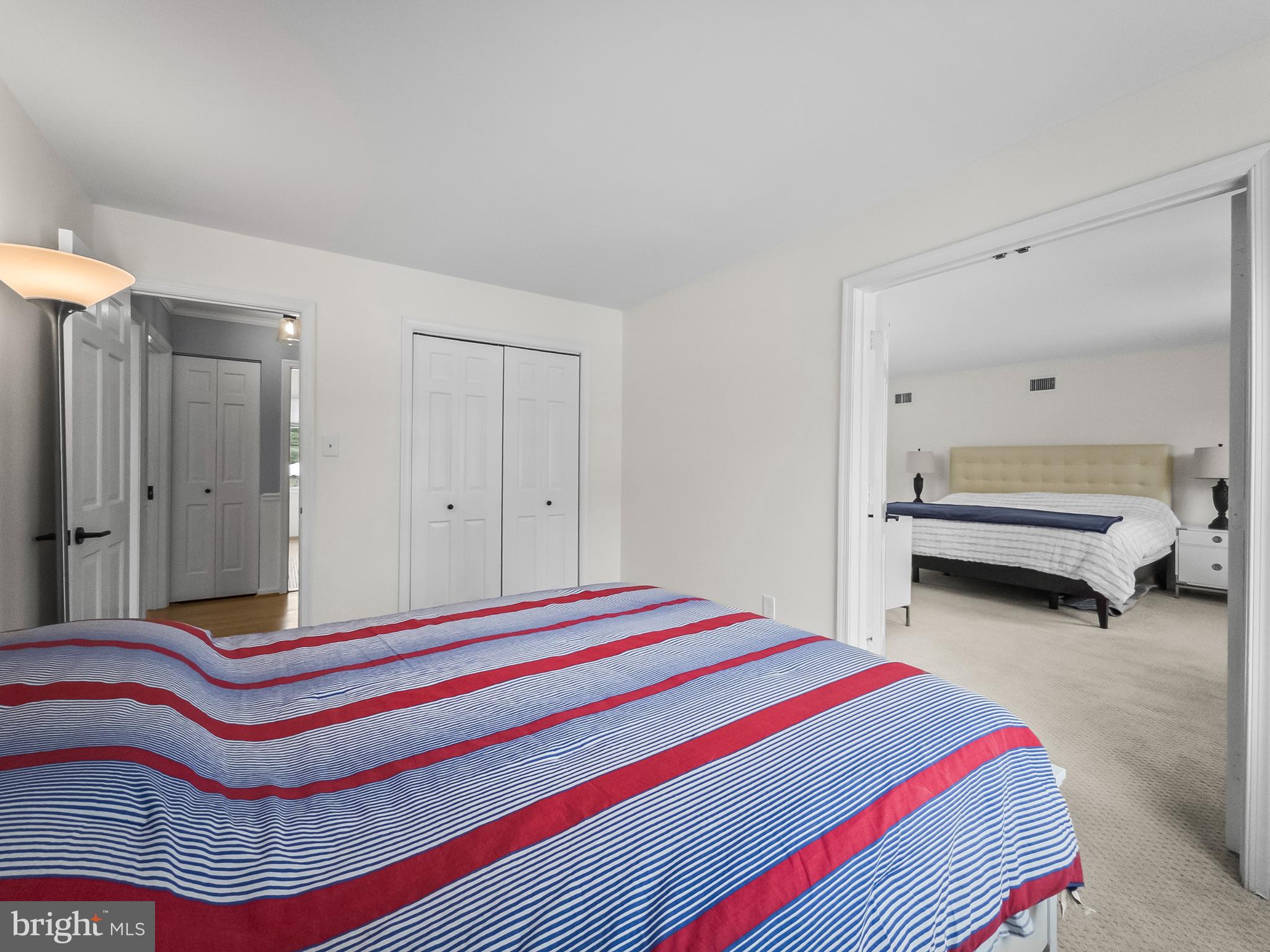 21600 Glendalough Road Gaithersburg, MD 20882 - Photo 44 of 64 a bedroom with bed and a chandelier