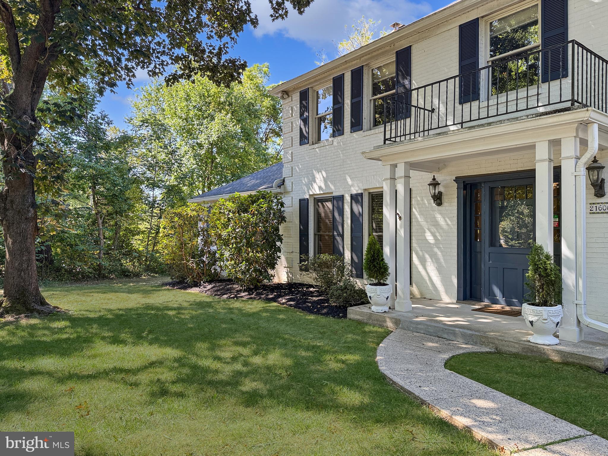 21600 Glendalough Road Gaithersburg, MD 20882 - Photo 55 of 64 a front view of a house with a yard